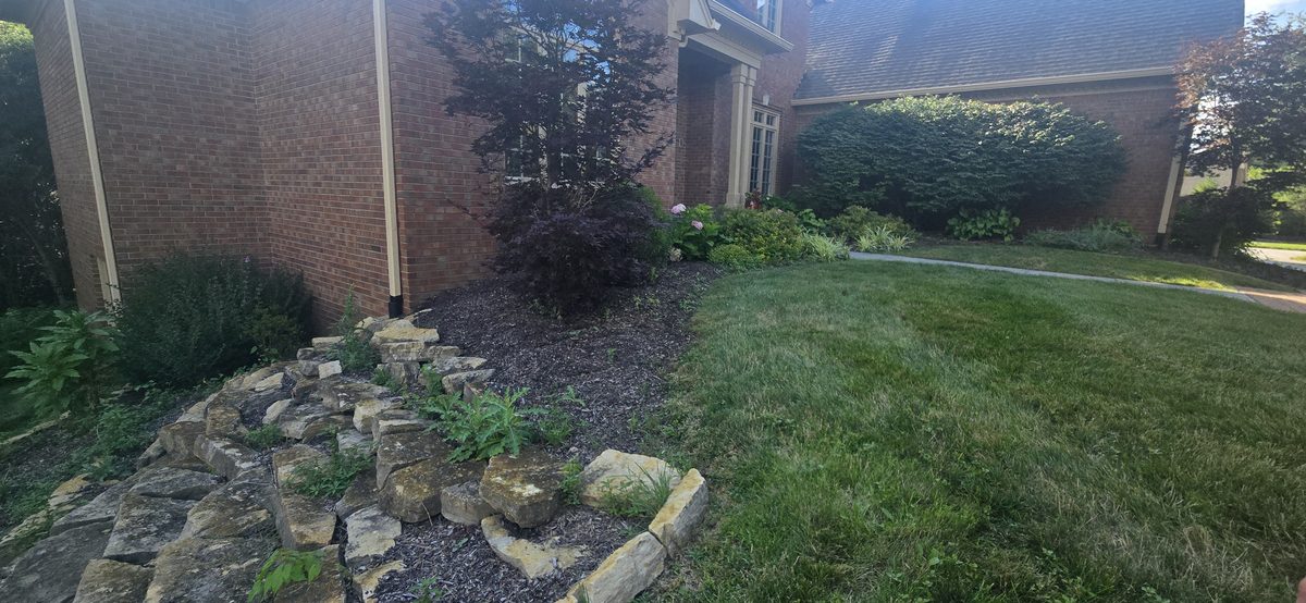 Natural stone rock bed garden installation