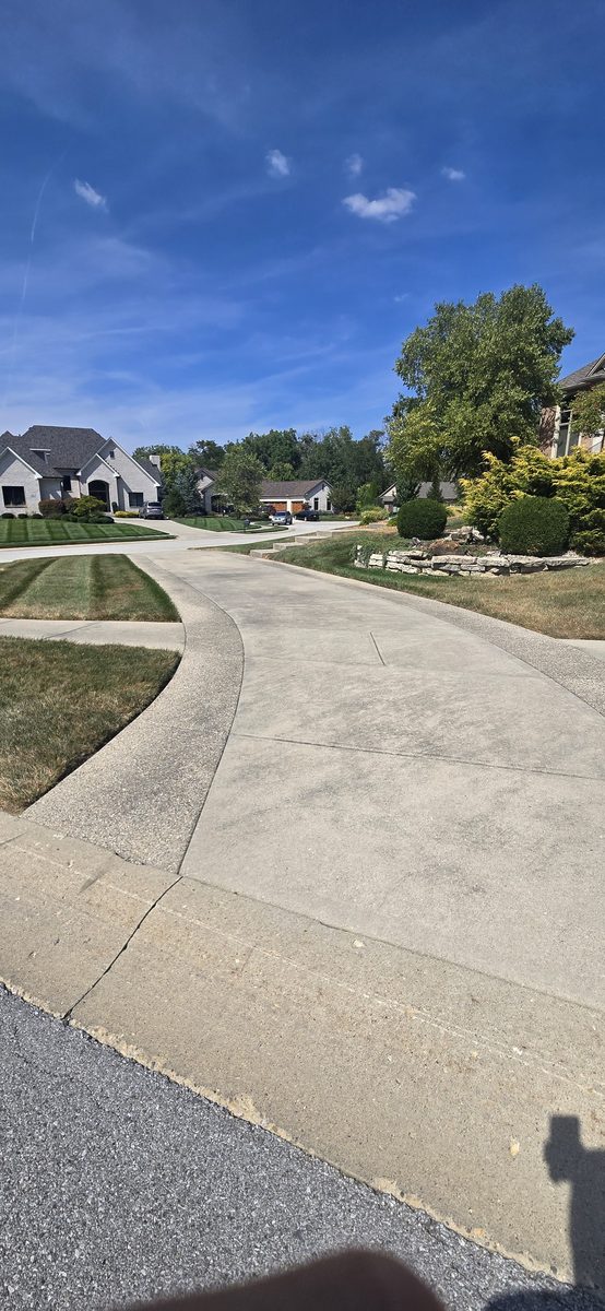 Clean driveway after power washing