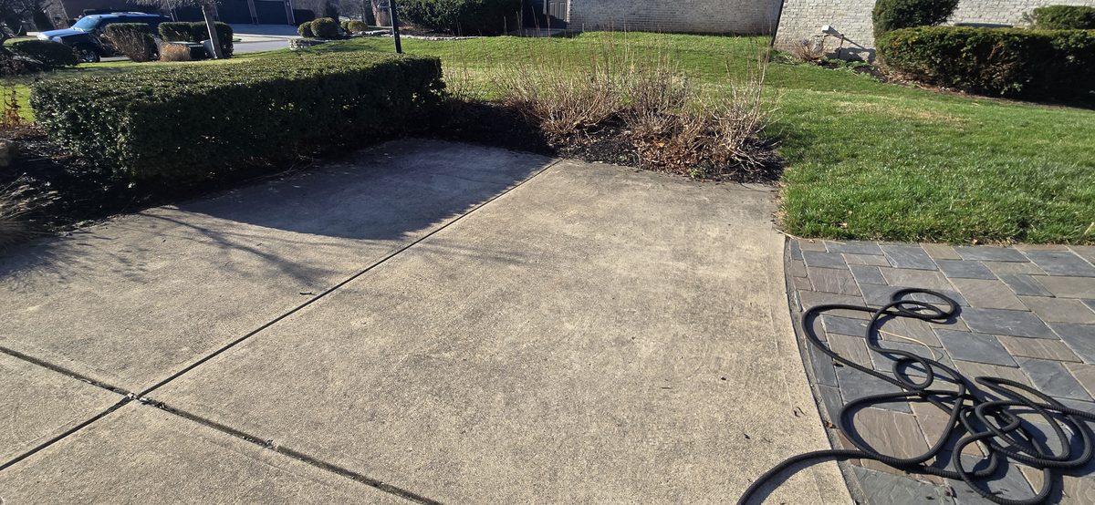 Driveway power washing in progress