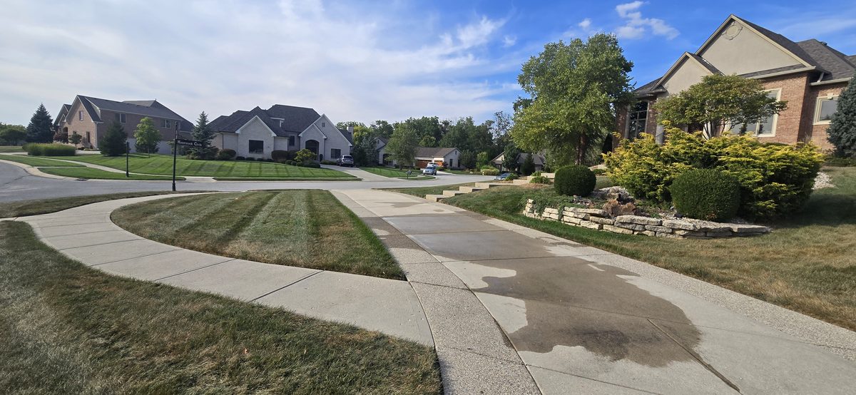 Neighborhood curb after pressure washing
