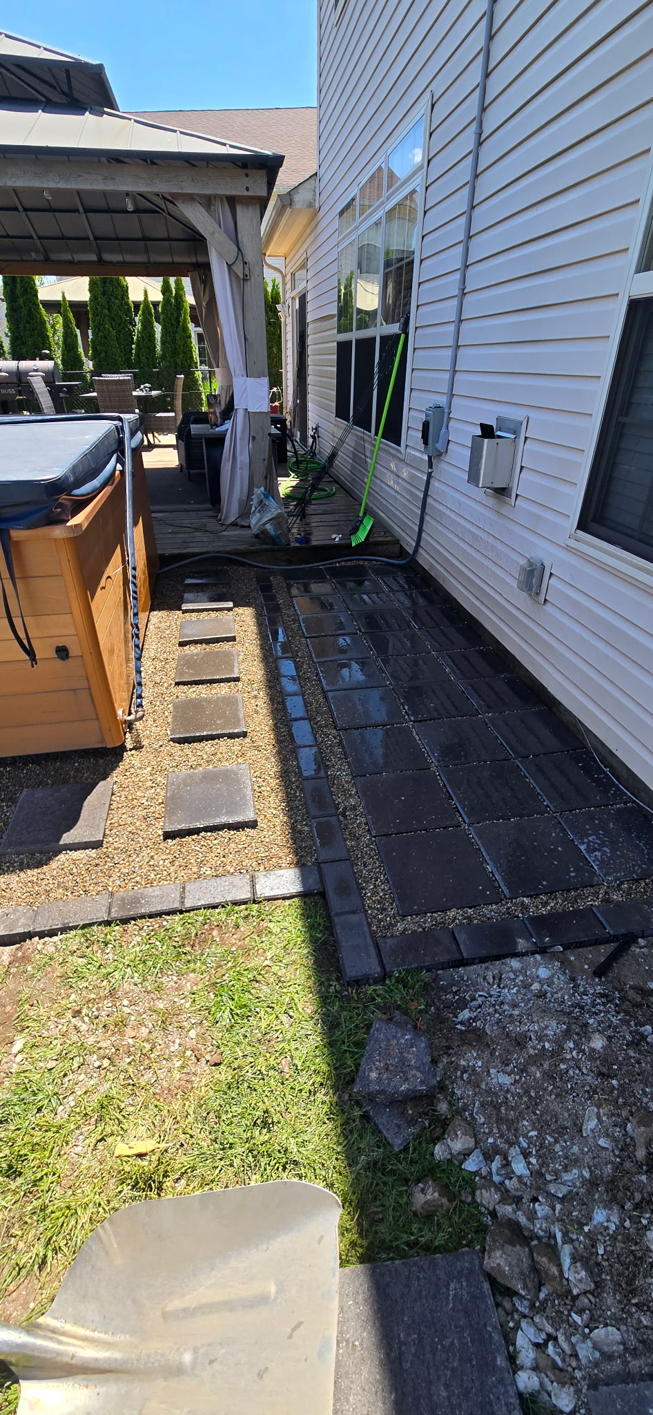 Paver walkway alongside house