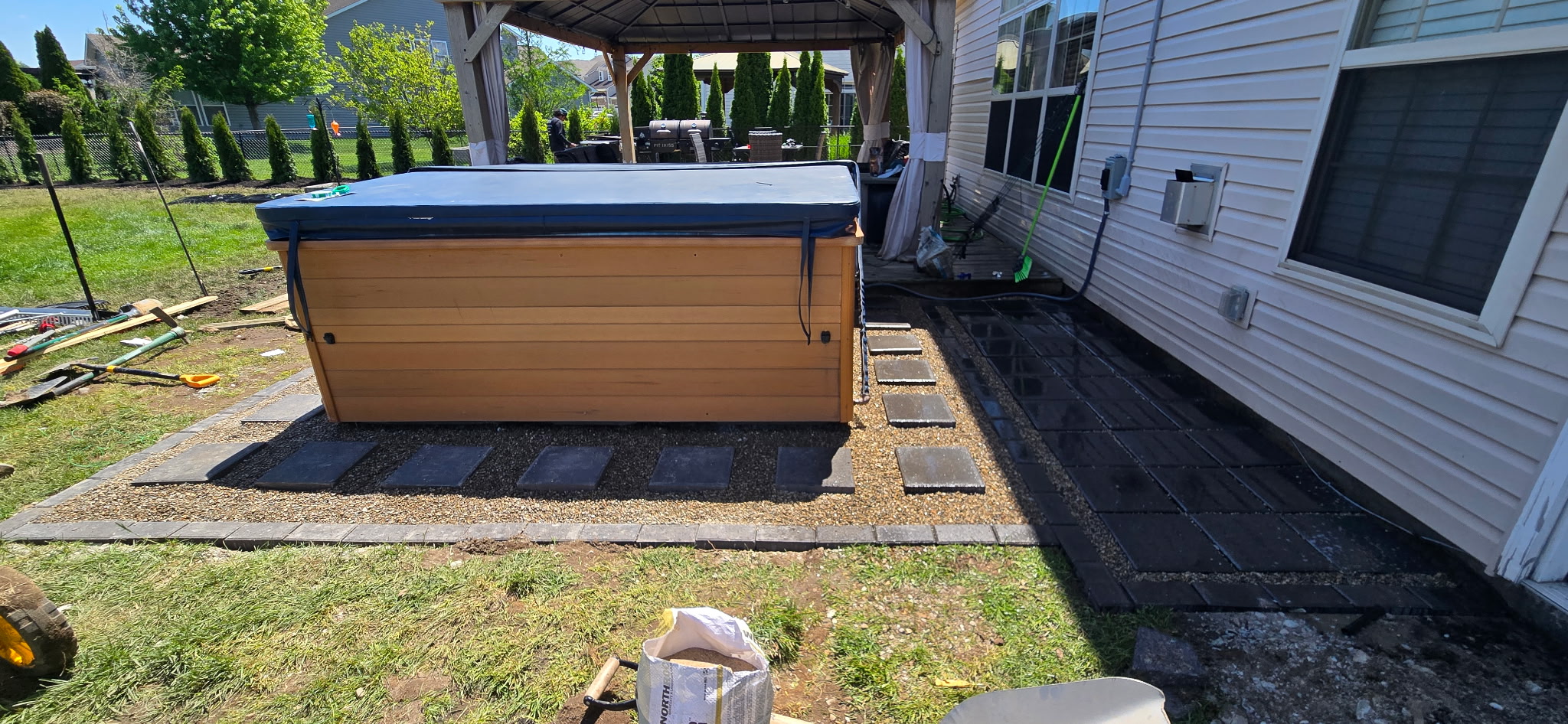 Paver patio with gazebo and hot tub
