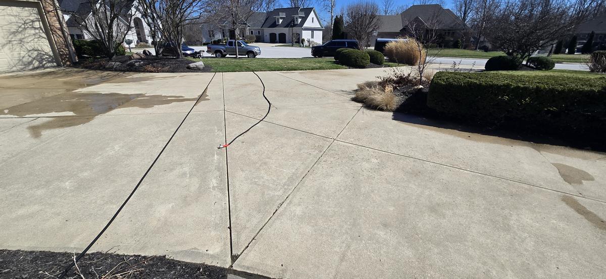 Clean driveway after power washing